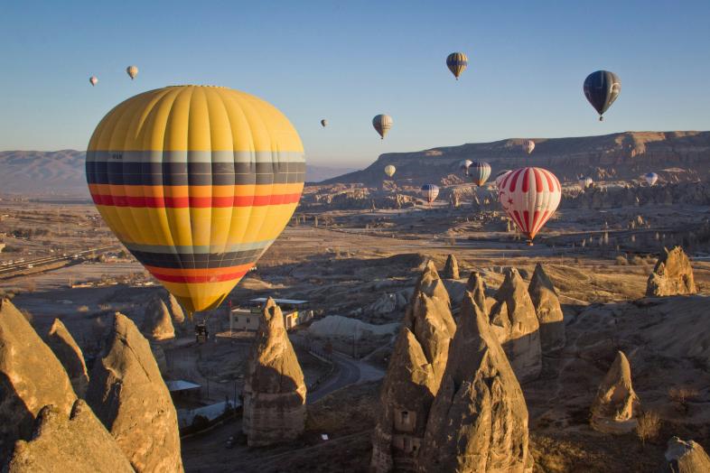 Hot air balloons floating above Cappadocia.